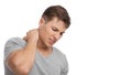 Despaired attractive millennial european muscular male suffer from neck pain, presses hand to sore spot