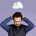 Despaired tired millennial hindu male suffer from pain, migraine and problems with abstract cloud and rain sign