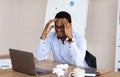 Desperate african american manager suffering from burnout