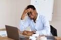 Desperate african american manager suffering from crisis