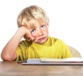 Desperate boy doing his homework Royalty Free Stock Photo