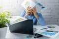 desperate businessman doing paperwork in office