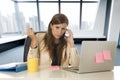 Desperate businesswoman suffering stress at office laptop computer desk Royalty Free Stock Photo