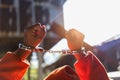 Desperate criminal man sitting on the floor in handcuffs. She arrested for robbery