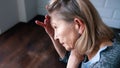 desperate lonely elderly woman having a headache