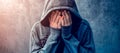 Desperate man in hooded jacket is crying Royalty Free Stock Photo