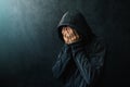 Desperate man in hooded jacket is crying Royalty Free Stock Photo