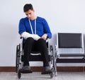 Desperate man waiting for his appointment in hospital with broke Royalty Free Stock Photo