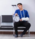 Desperate man waiting for his appointment in hospital with broke Royalty Free Stock Photo