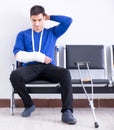 Desperate man waiting for his appointment in hospital with broke Royalty Free Stock Photo