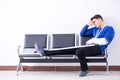 Desperate man waiting for his appointment in hospital with broke Royalty Free Stock Photo