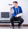 Desperate man waiting for his appointment in hospital with broke Royalty Free Stock Photo