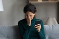 Desperate millennial woman get phone message about dismissal from job Royalty Free Stock Photo