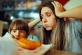 Desperate Mom Watching her Kid Eating only Fast food Meals Royalty Free Stock Photo