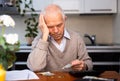 Desperate old man pensioner counting his last money