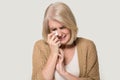 Desperate old woman crying wiping tears with handkerchief Royalty Free Stock Photo