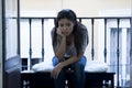 Desperate sad Latin woman at home balcony looking devastated and depressed suffering depression Royalty Free Stock Photo