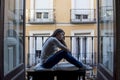 Desperate sad Latin woman at home balcony looking devastated and depressed suffering depression Royalty Free Stock Photo