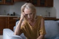 Desperate sad mature 50s woman getting bad news