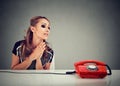 Desperate sad woman waiting for someone to call her Royalty Free Stock Photo