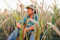 Desperate senior agricultor standing in drought-damaged corn crop. Royalty Free Stock Photo