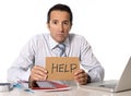 Desperate senior businessman in crisis working on computer at office in stress