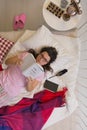 Desperate spinster lying in bed Royalty Free Stock Photo