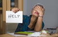 Desperate and stressed attractive middle aged Asian woman holding notepad asking for help feeling overworked and exploited working Royalty Free Stock Photo