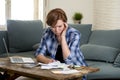 Desperate woman banking and accounting home monthly and credit card expenses with computer laptop doing paperwork Royalty Free Stock Photo