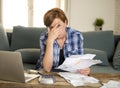 Desperate woman banking and accounting home monthly and credit card expenses with computer laptop doing paperwork Royalty Free Stock Photo