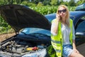 desperate woman calling the rescues for the car