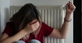 Desperate woman sits at radiator shackled by handcuffs