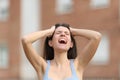 Desperate woman yelling in the street Royalty Free Stock Photo