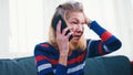 Desperate worried elderly woman having a phone call Royalty Free Stock Photo