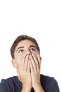 Desperate youg boy with hands on face Royalty Free Stock Photo