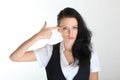 Desperate young business woman under pressure with a finger gun gesture