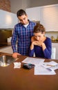 Desperate young couple with debts reviewing their Royalty Free Stock Photo