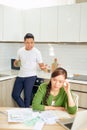Desperate young couple with many debts reviewing their bills. Financial family problems concept Royalty Free Stock Photo