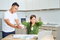 Desperate young couple with many debts reviewing their bills. Financial family problems concept Royalty Free Stock Photo