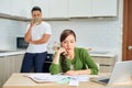 Desperate young couple with many debts reviewing their bills. Financial family problems concept Royalty Free Stock Photo