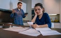 Desperate young couple with debts reviewing their bills Royalty Free Stock Photo