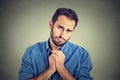 Desperate young man showing clasped hands, pretty please asking help forgiveness Royalty Free Stock Photo