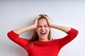 Desperate young teen girl screaming, depressed, female at a loss, touching head Royalty Free Stock Photo