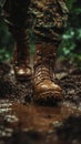 Despite the mud, military boots trudge through it, each step a testament to the gritty realities of ground operations Royalty Free Stock Photo