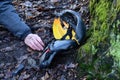 Despite protective equipment, the man ended up injured with a shattered helmet on the ground in the woods after falling from a bic