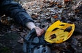 Despite protective equipment, the man ended up injured with a shattered helmet on the ground in the woods after falling from a bic