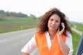 Despondent female driver trying to summon help Royalty Free Stock Photo