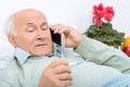 Despondent weary aged man calls up his relatives