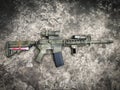 Dessert assault rifles airsoft gun on the ground Royalty Free Stock Photo