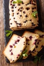 Dessert baking black currant cake close-up on the table. Vertical top view